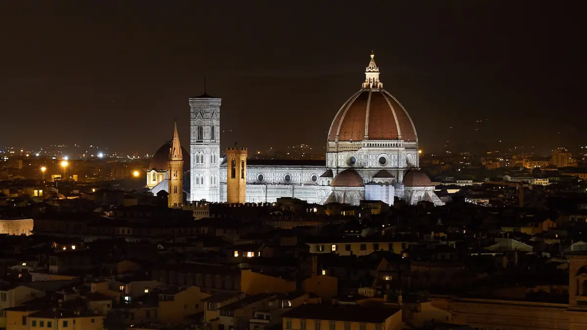 The cathedral and bell tower lit at night