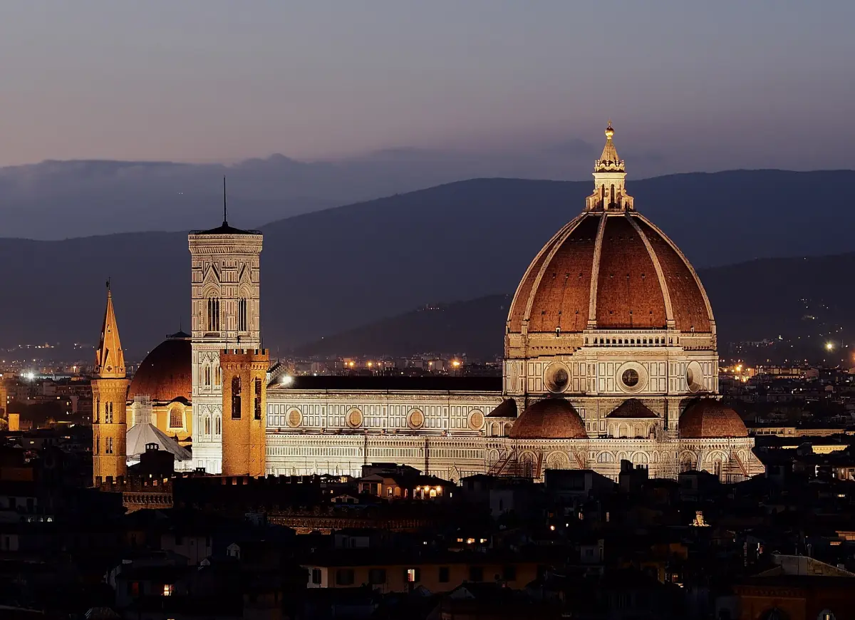 Florence Cathedral and its dome above the city at dusk
